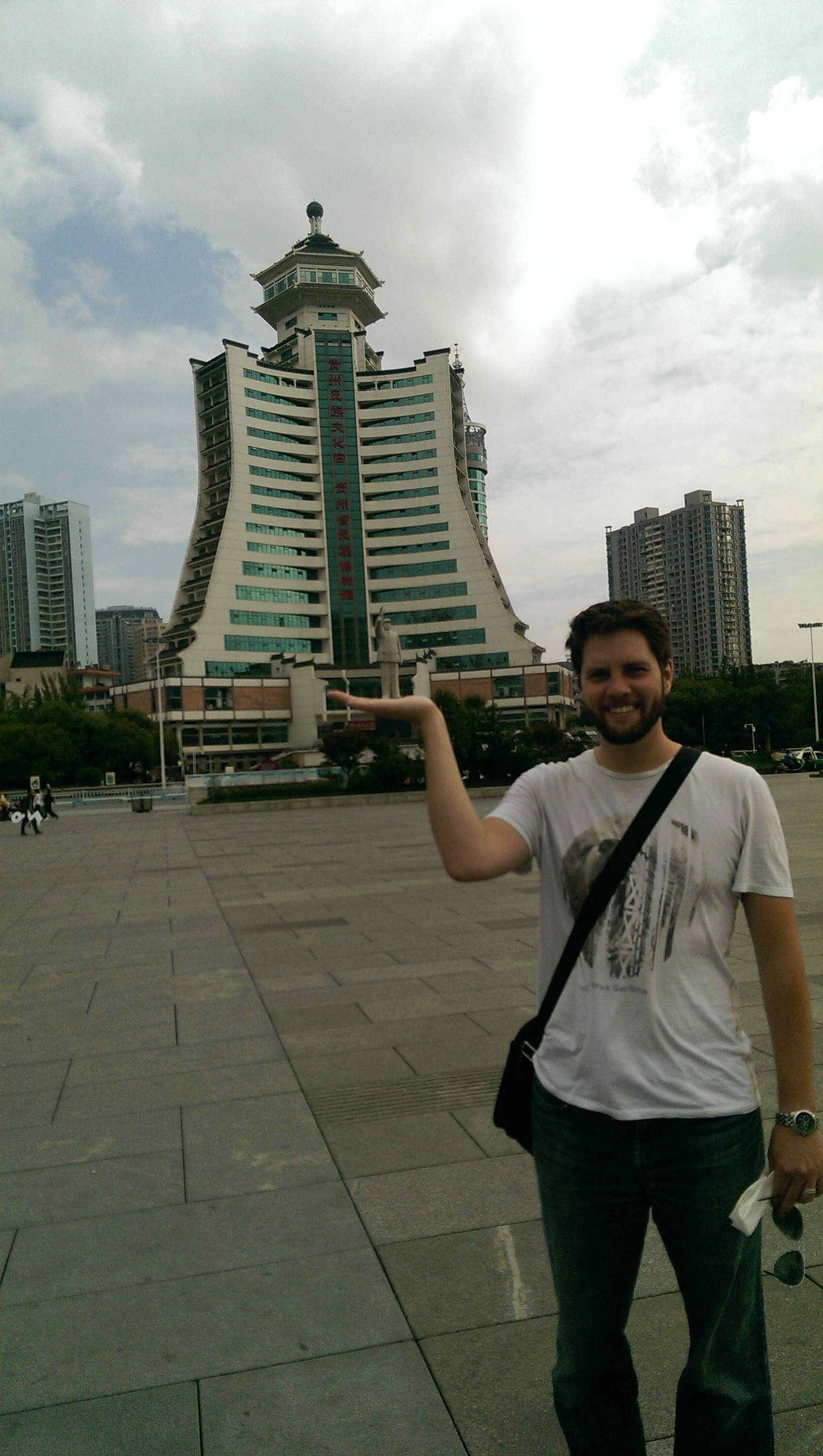 This is Dave, happily holding up a statue of Chairman Mao.