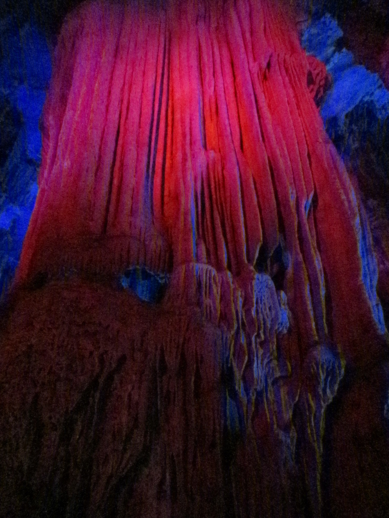 Beautiful formations, lit up with red lights.  These took thousands of years to form.  Nature is so cool :)