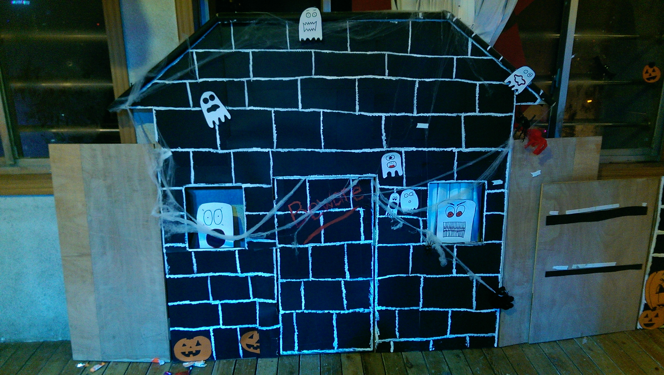 One of the haunted houses I came in to finish on my day off.  I can't complain too much, seeing as how I love arts and crafts :)  