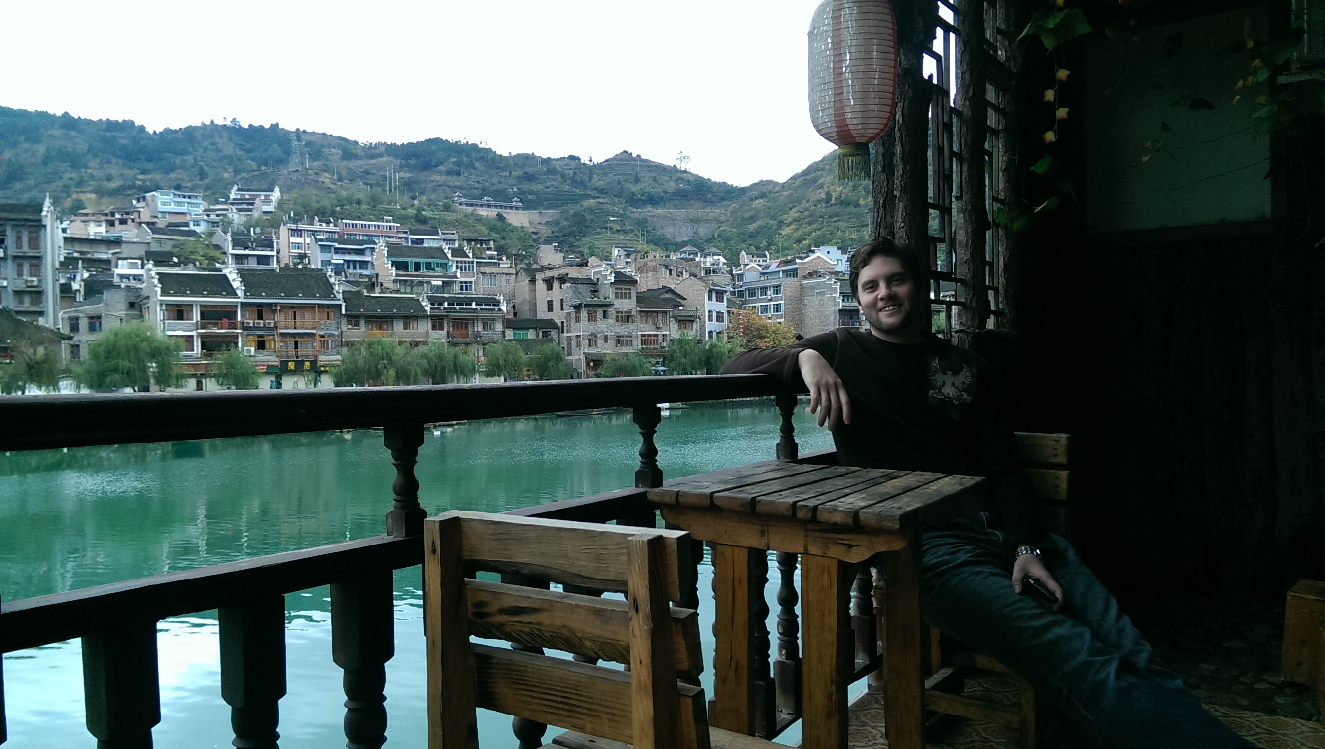 Dave, sitting on our room's balcony, overlooking the river 