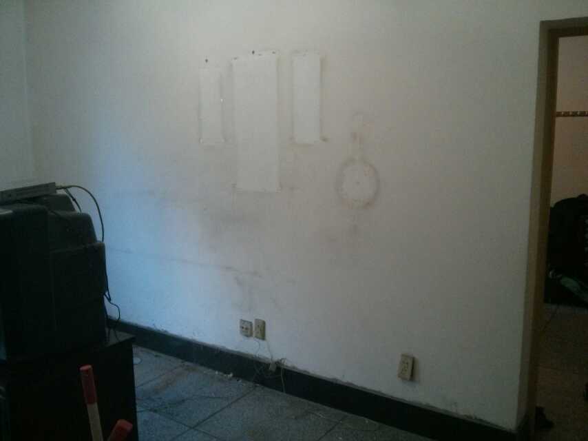 The living room wall before we painted...